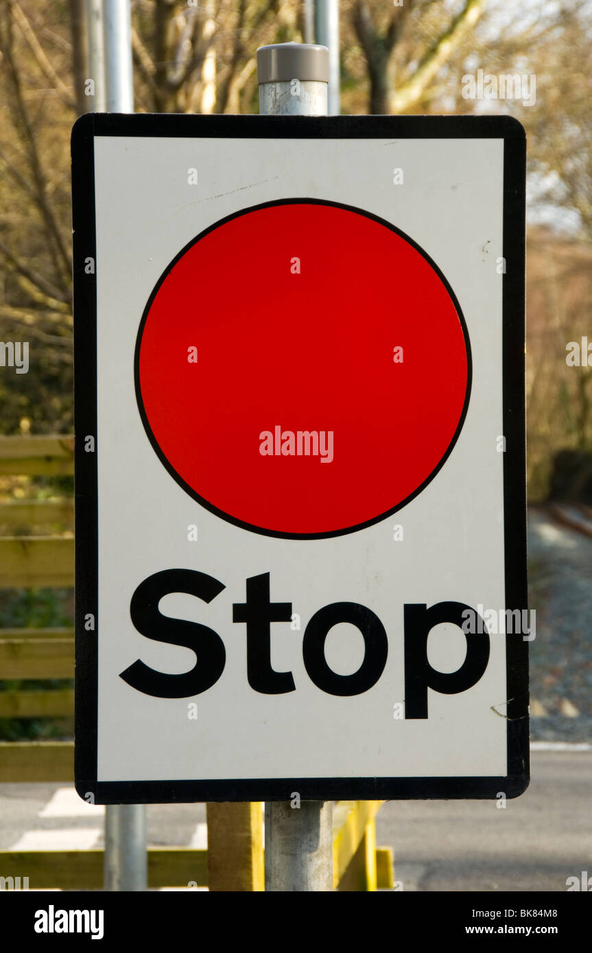 Stop sign at a level crossing, Welsh Highland Railway, Nantmor, Snowdonia, North Wales, UK Stock Photo