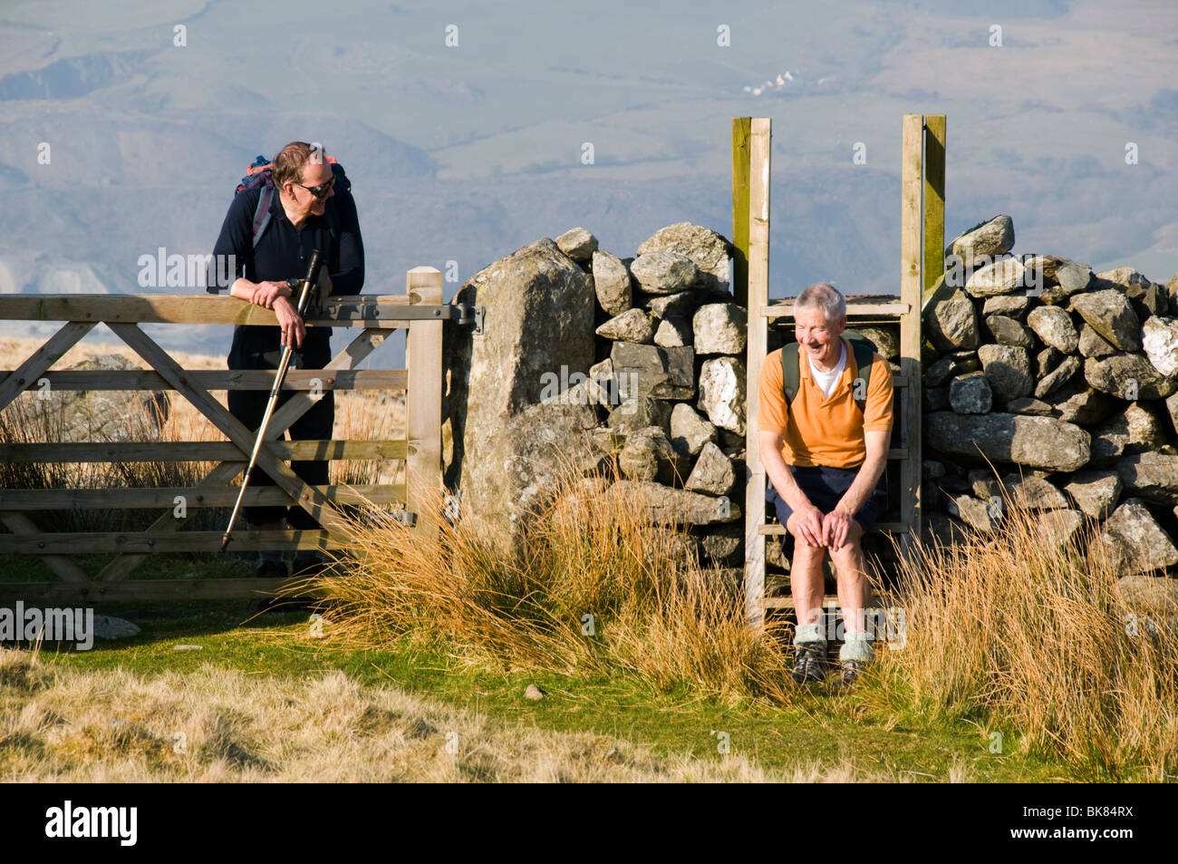 Two walkers chatting in Cwm Silyn, Snowdonia, North Wales, UK Stock Photo
