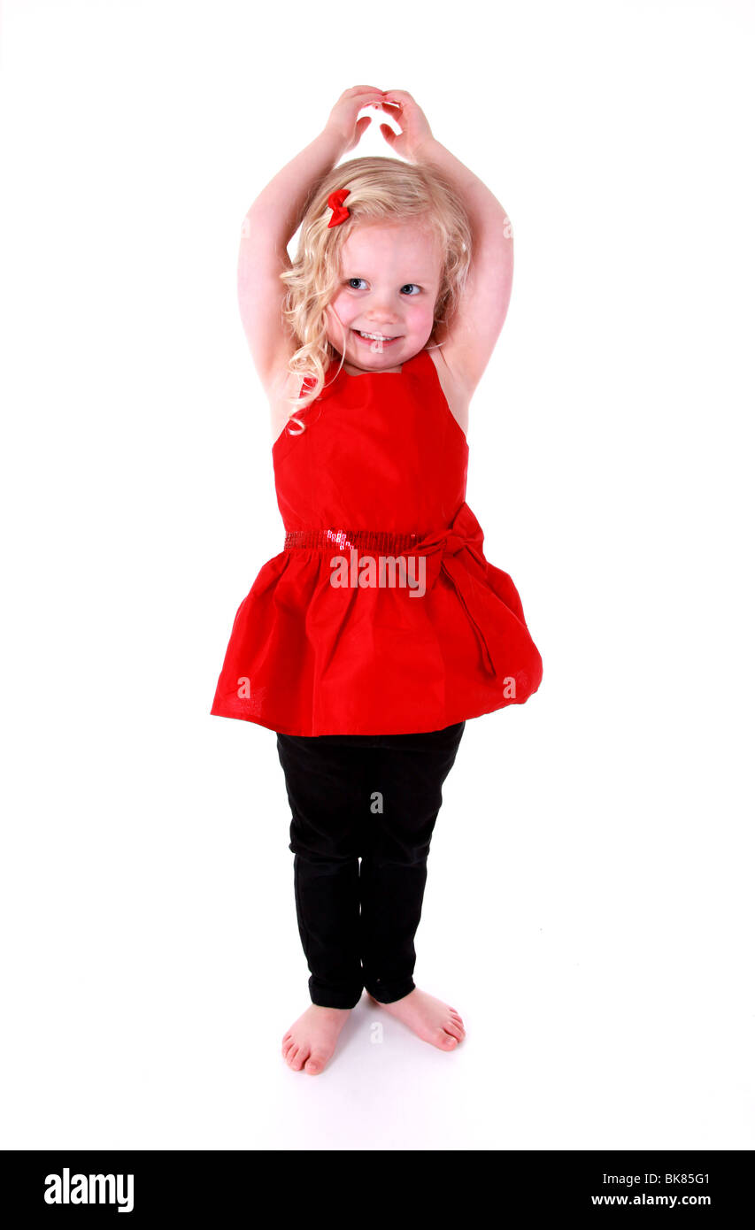 4 yr old girl dancing in red dress Stock Photo - Alamy