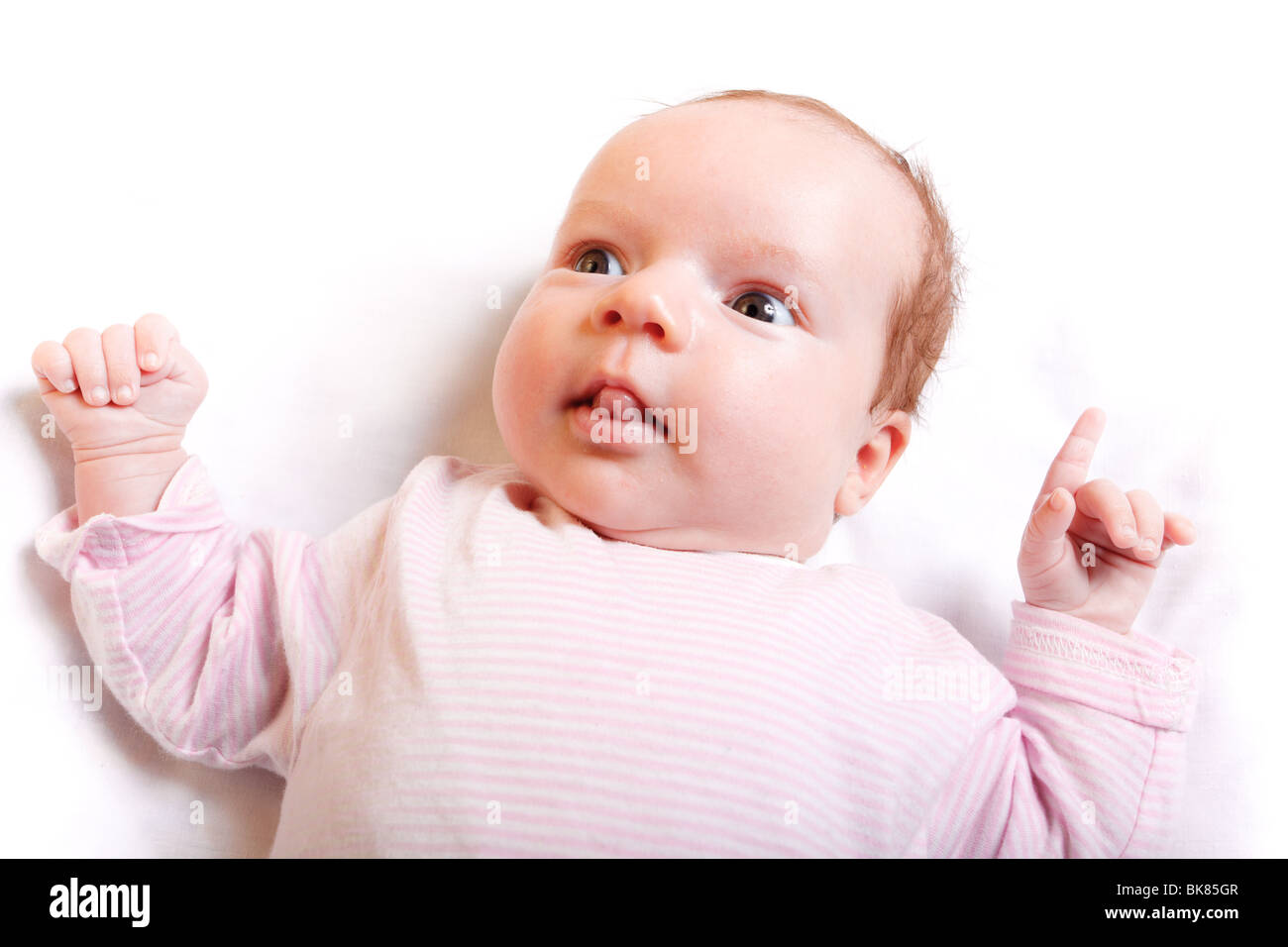 A nice small baby curiously looking around Stock Photo