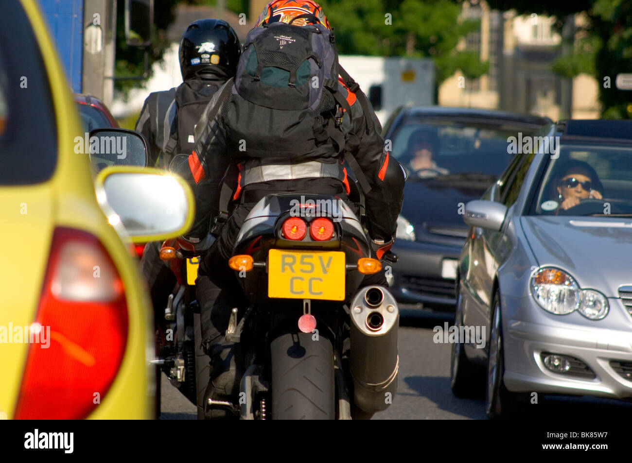 Motorcycle Weaving Through Traffic Stock Photo Alamy
