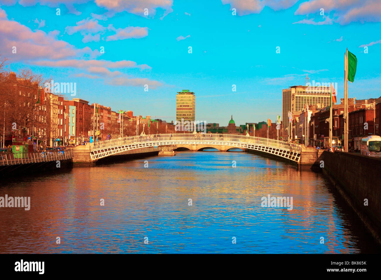 The H'apenny Bridge over the river Liffey in Dublin city centre and ...