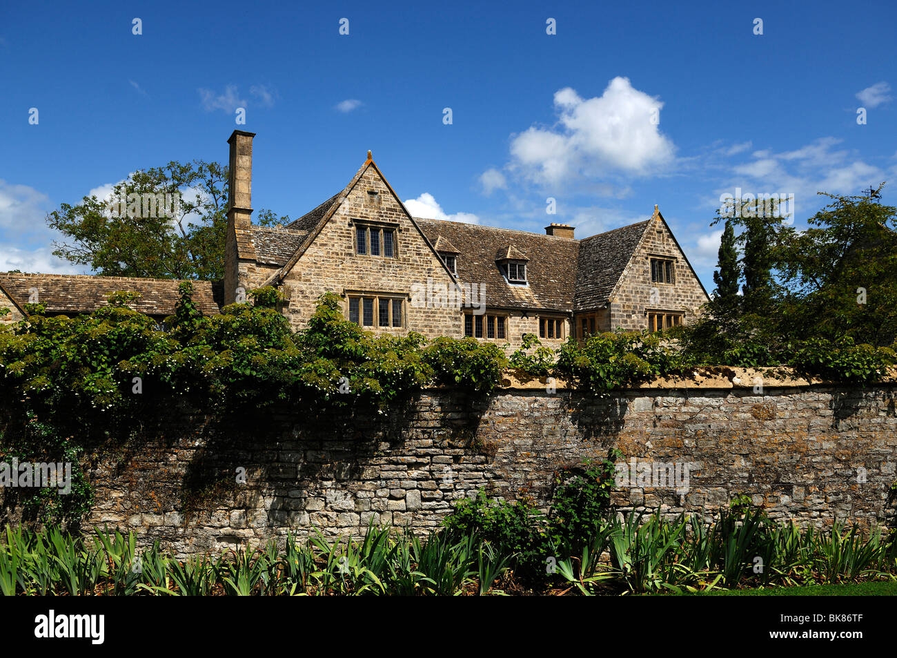 Old manor house behind a wall, Armscote, Warwickshire, England, United