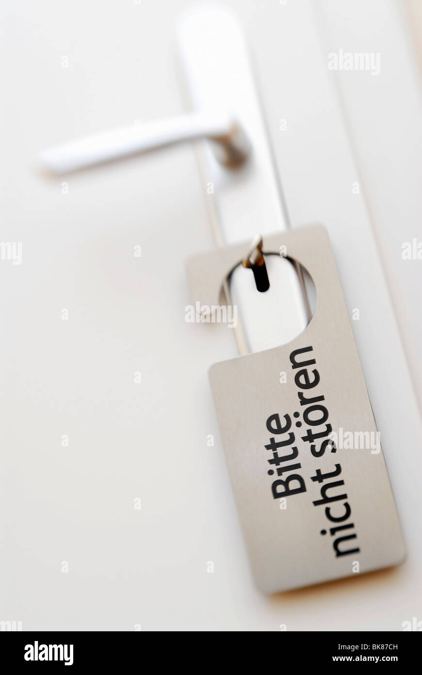 Door with a Do not disturb sign in German, Bitte nicht stoeren Stock Photo