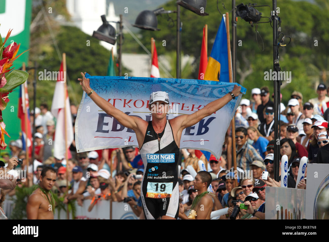 The German professional triathlete Christian Brader at the finish linr of the Ironman Triathlon World Championship in Kailua-Ko Stock Photo