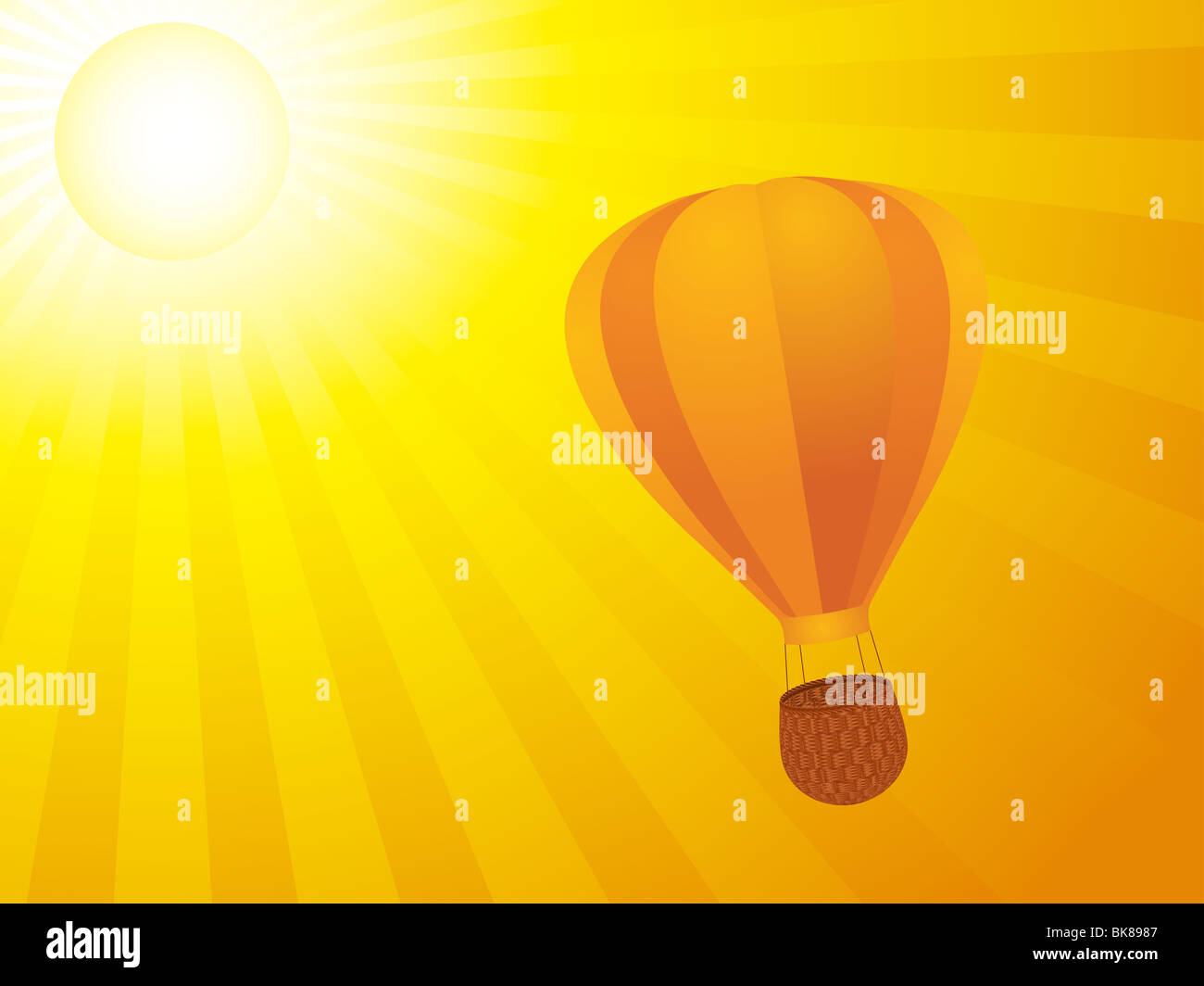 Hot air balloon floating in an orange sunset sky Stock Photo - Alamy