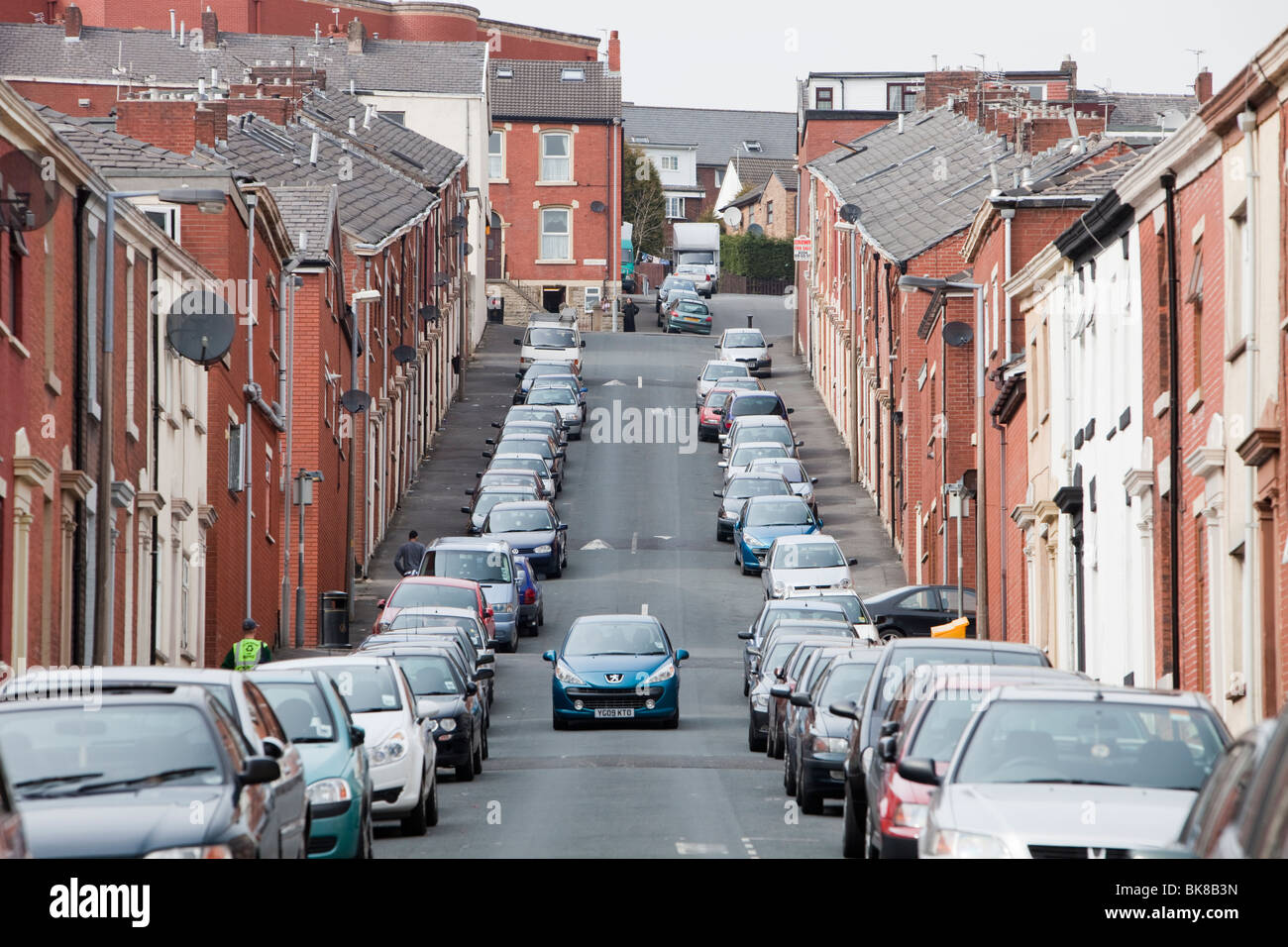 Cars parked on the street in a muslim area of Blackburn, Lancashire, UK, Stock Photo