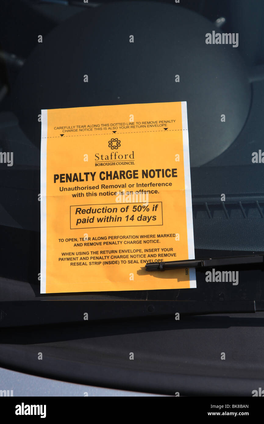 a uk parking ticket on the windscreen of a car in Stafford Stock Photo
