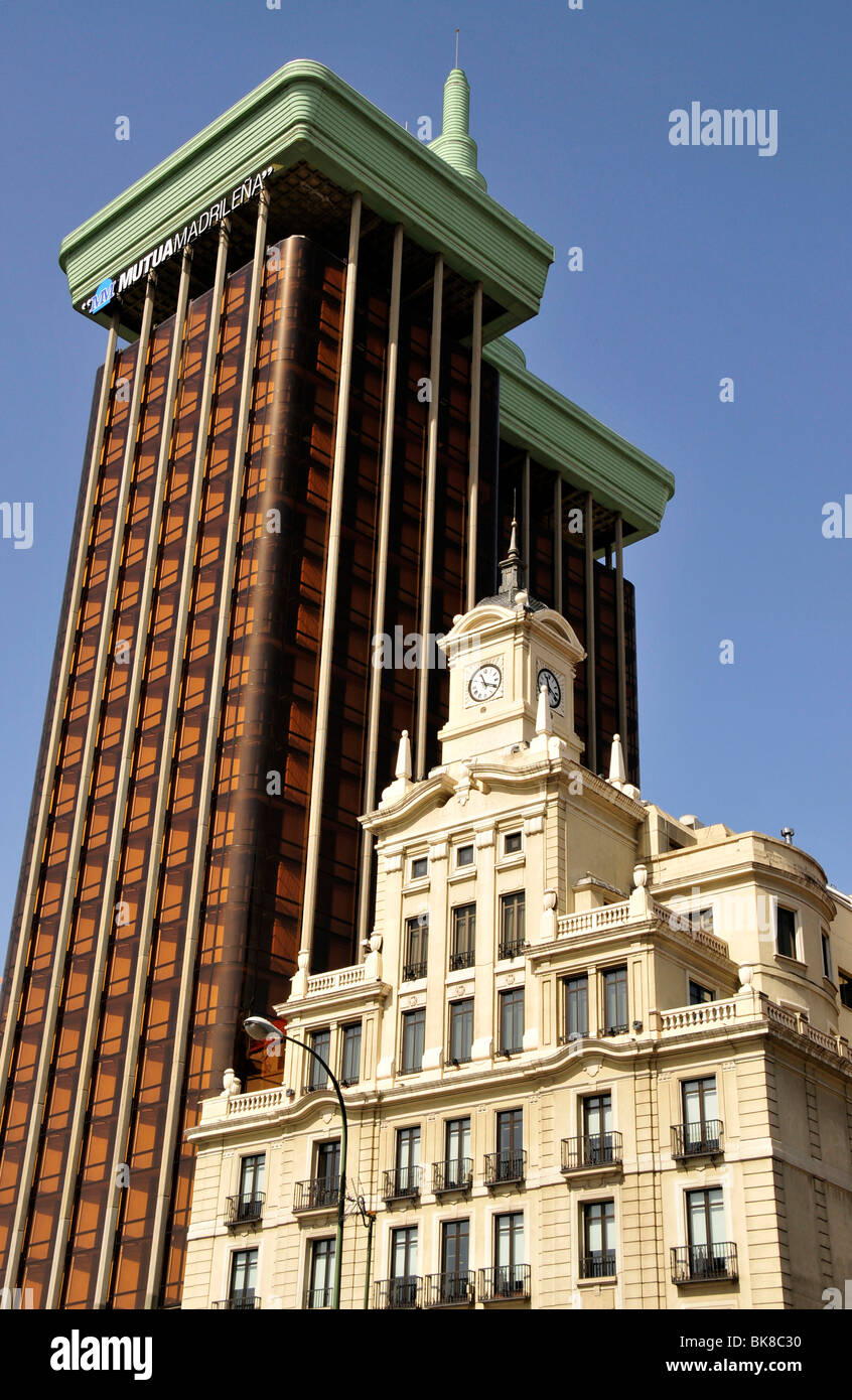 Old clock tower in front of the Torres de Colón building on the Plaza ...