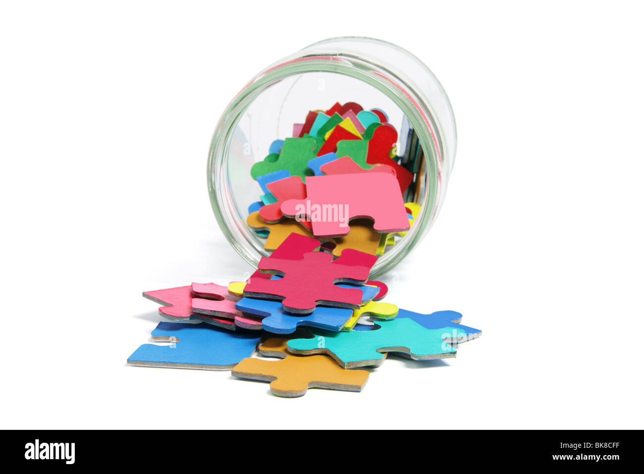 Jigsaw Puzzle Pieces in Glass Jar Stock Photo