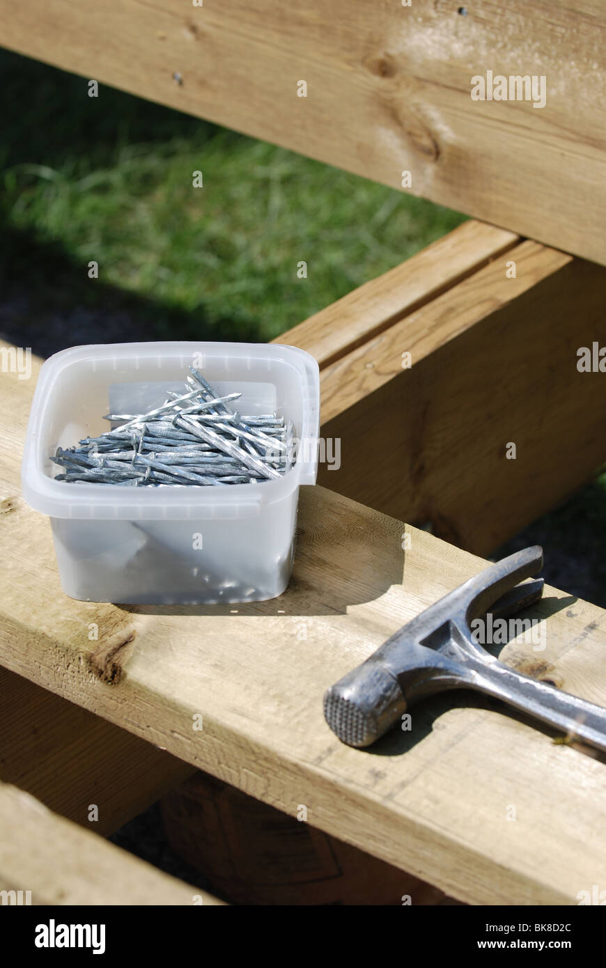 Hammer and nails on a wooden construction Stock Photo Alamy