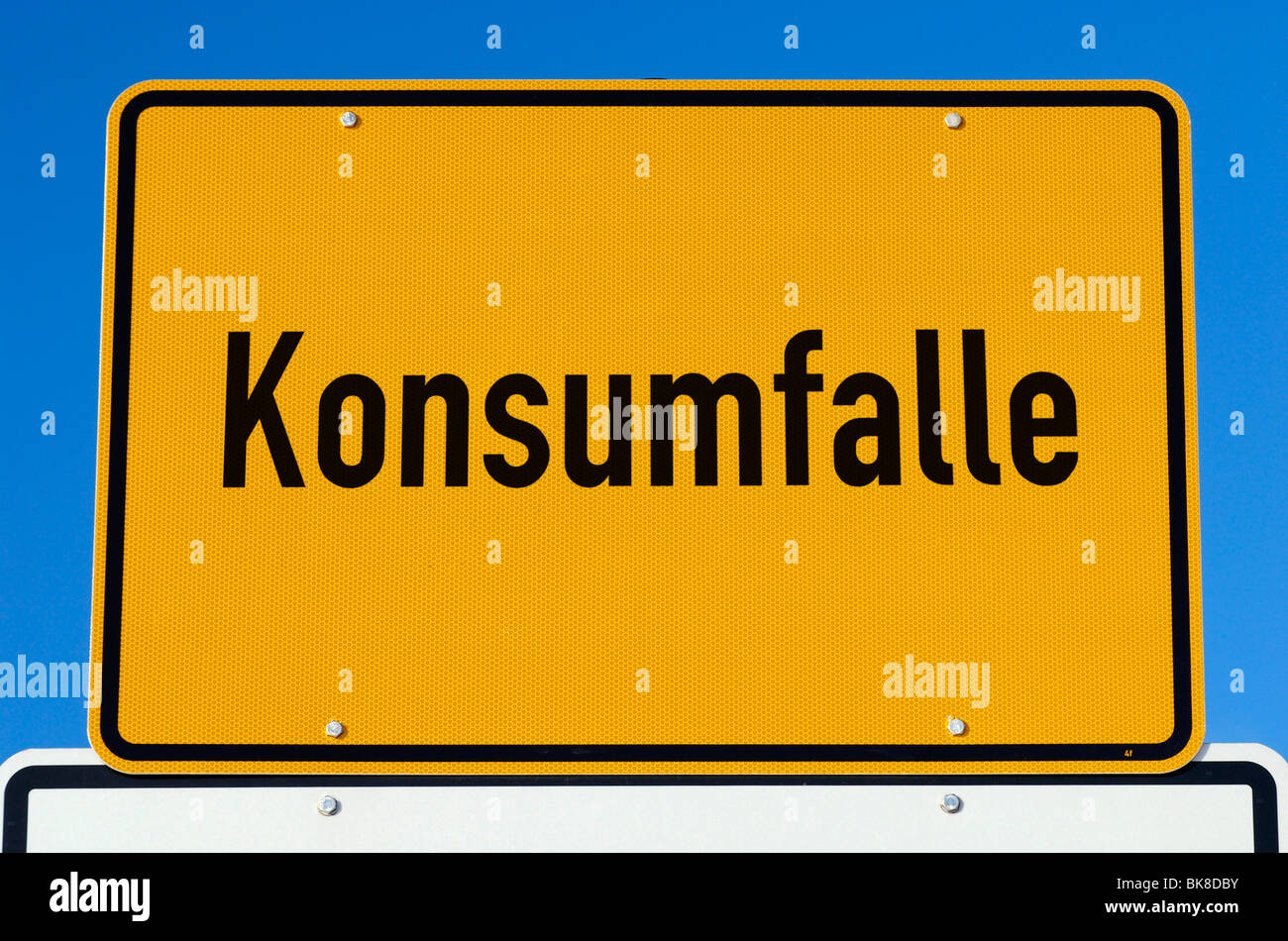 City limits sign "Konsumfalle", consumerism trap Stock Photo Alamy