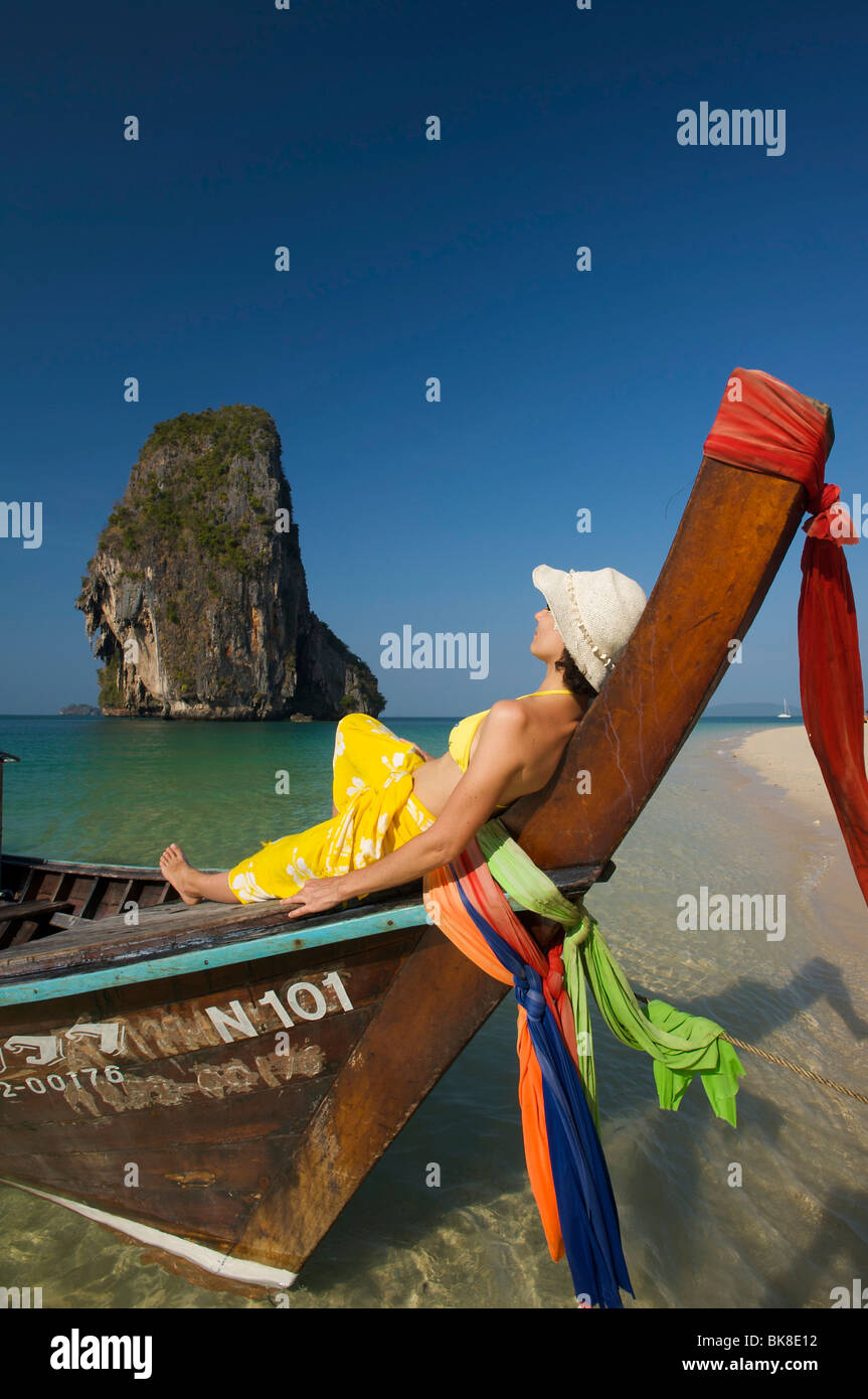 Woman on a long-tail boat on Laem Phra Nang Beach, Krabi, Thailand, Asia Stock Photo