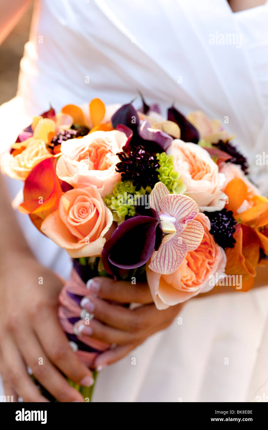 bride bouquet, colorful flowers orange, purple, peach, yellow, white Stock Photo