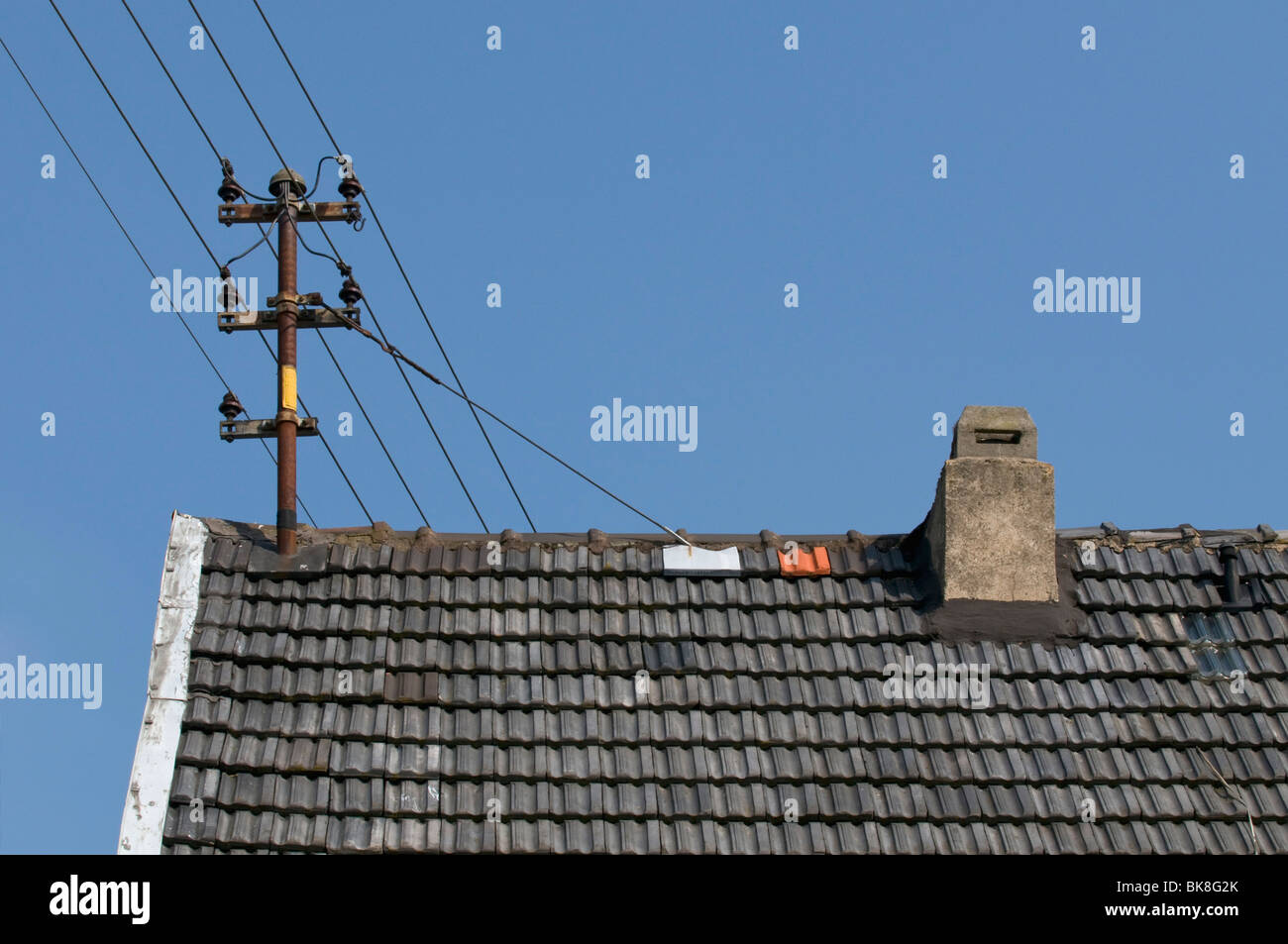 Old power lines with ceramic insulators on roof Stock Photo Alamy