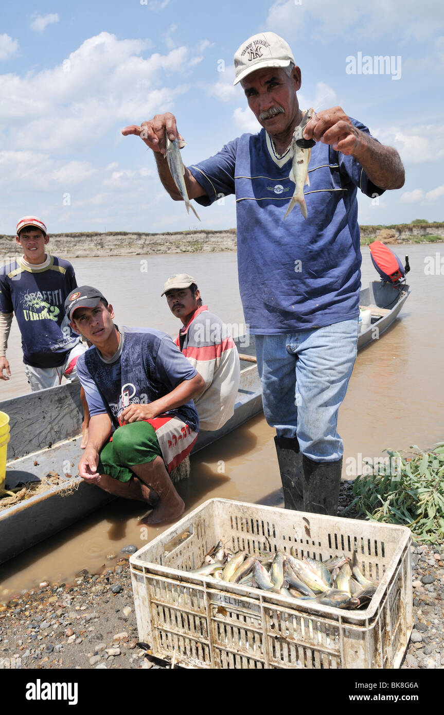 Fisherman with his catch on the Rio Magdalena River, La Dorada, Caldas, Colombia, South America Stock Photo