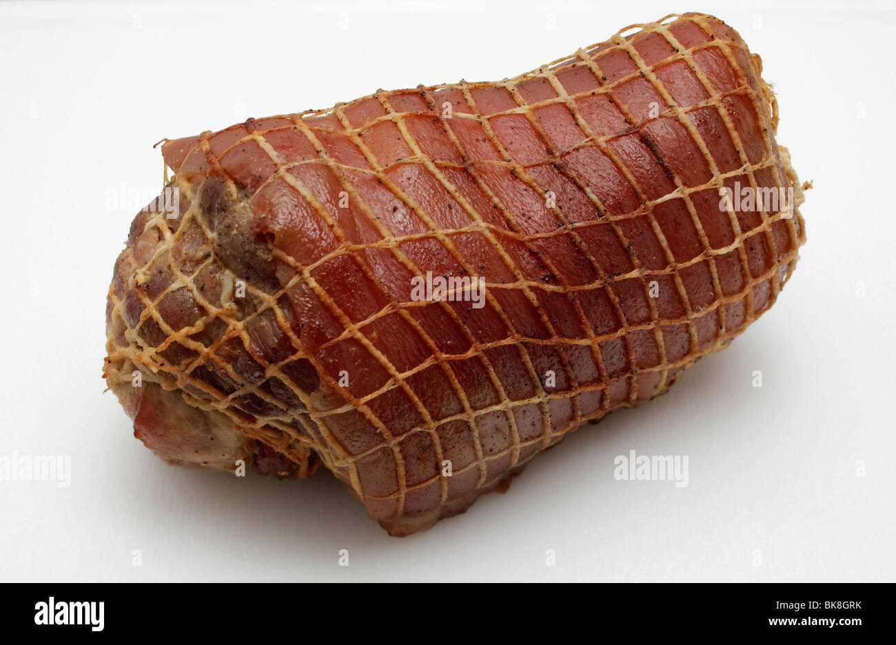 Rolled pork roast in a net Stock Photo Alamy