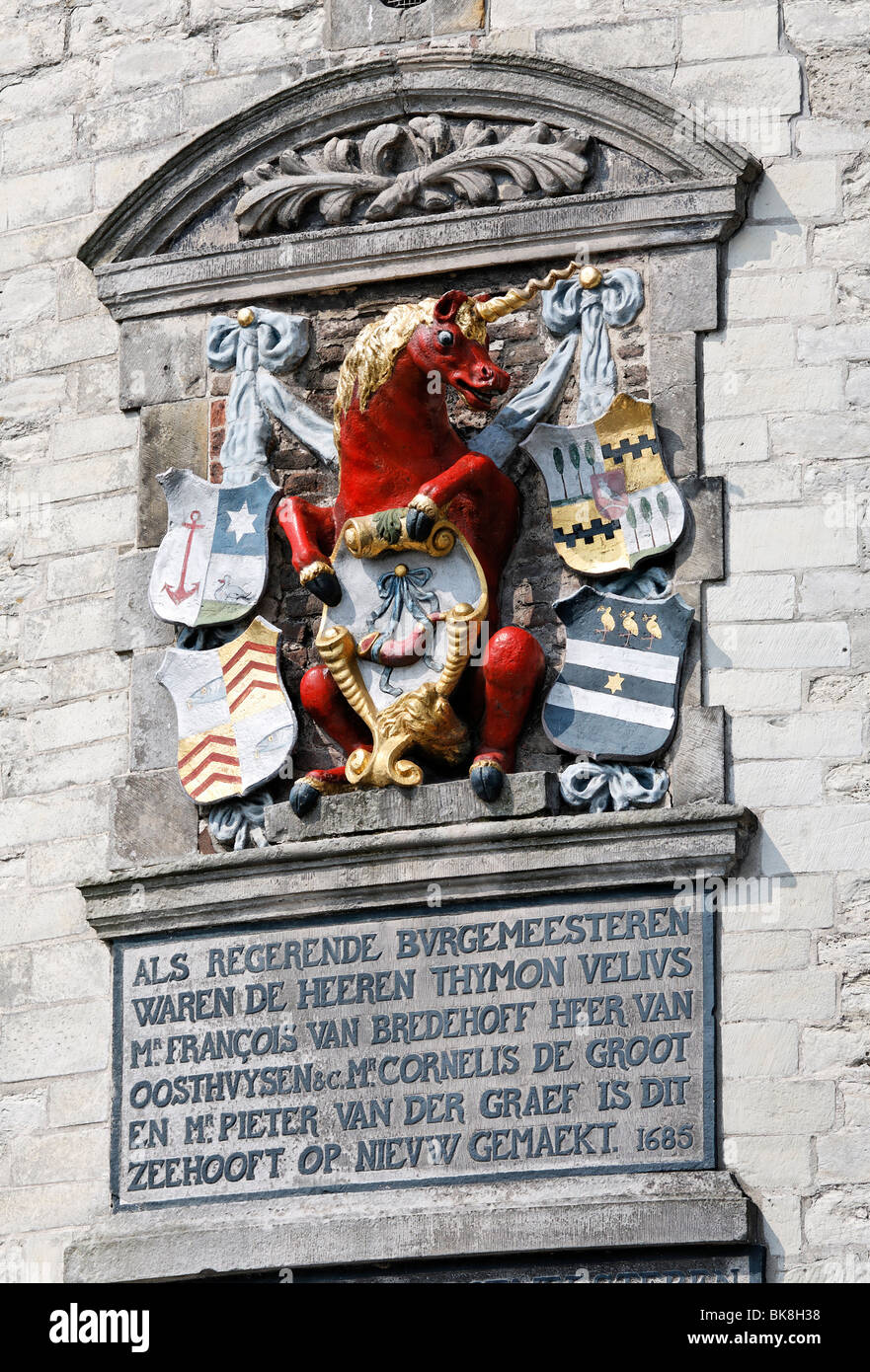 City arms with unicorn and inscription at the historic fortified tower Hoofdtoren, harbour of Hoorn, IJsselmeer, Province of No Stock Photo