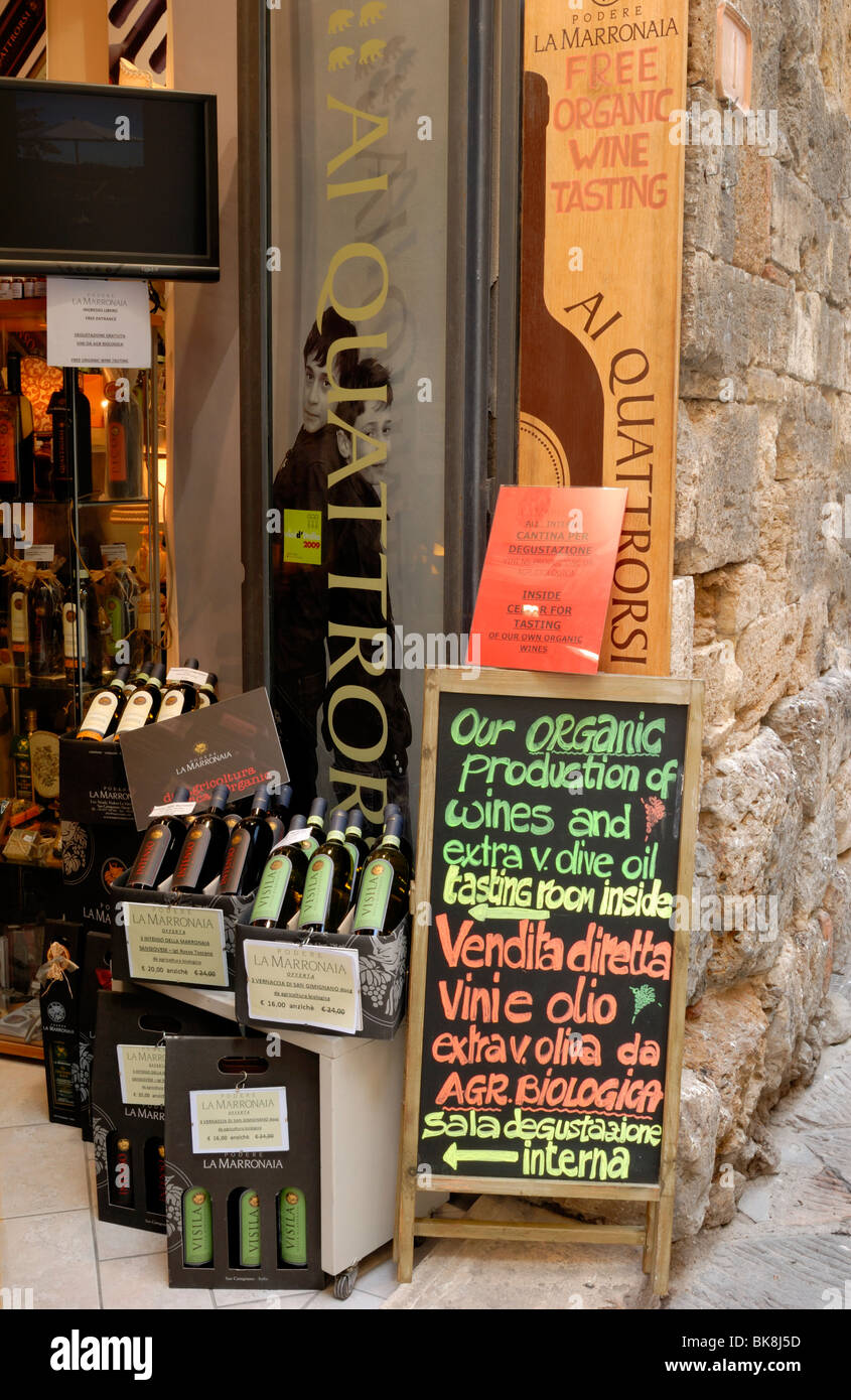 Al Quattrorsi shop is selling local Organic wines and Extra virgin olive oil. Via San Matteo, San Gimignano, Tuscany, Italy, EU. Stock Photo