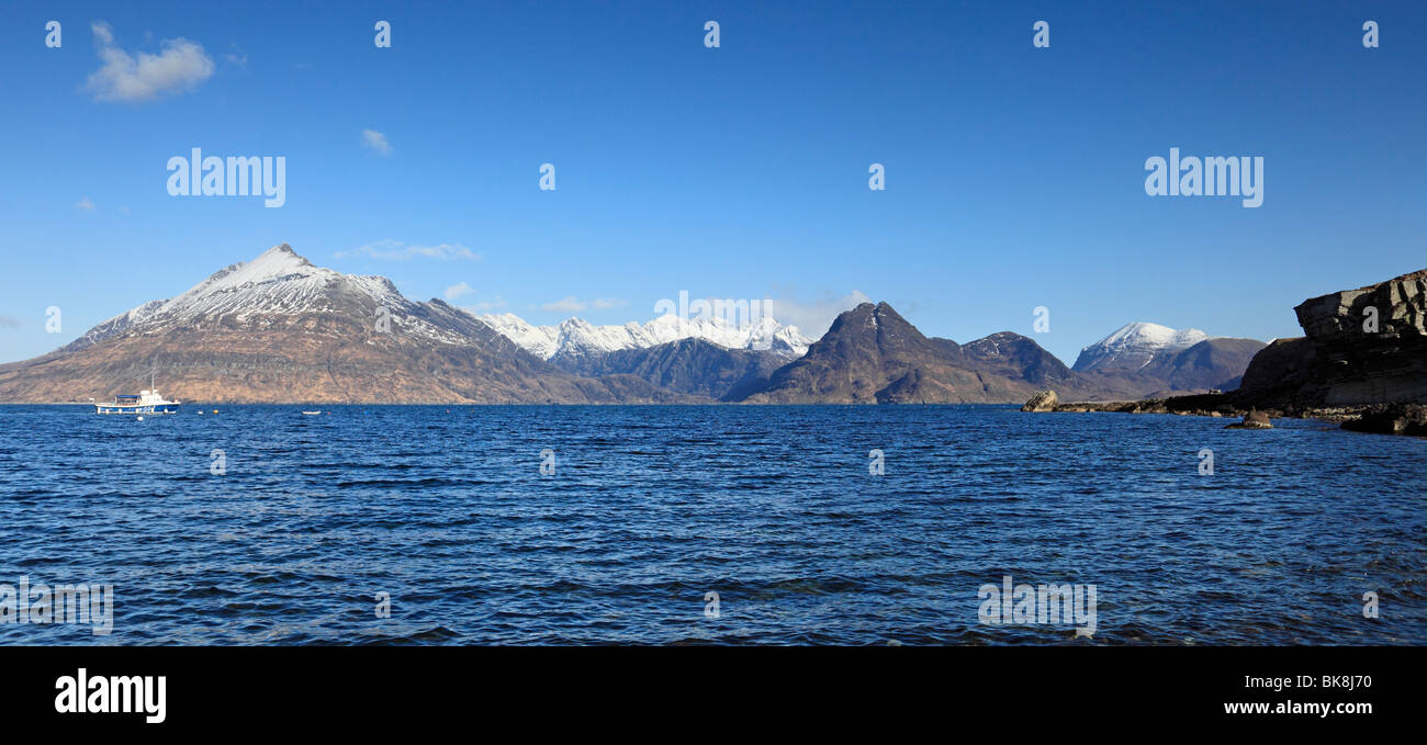 Elgol and Loch Scavaig on the Isle of Skye, Scotland, with fantastic views across to snow capped Cuillin mountains in Spring Stock Photo