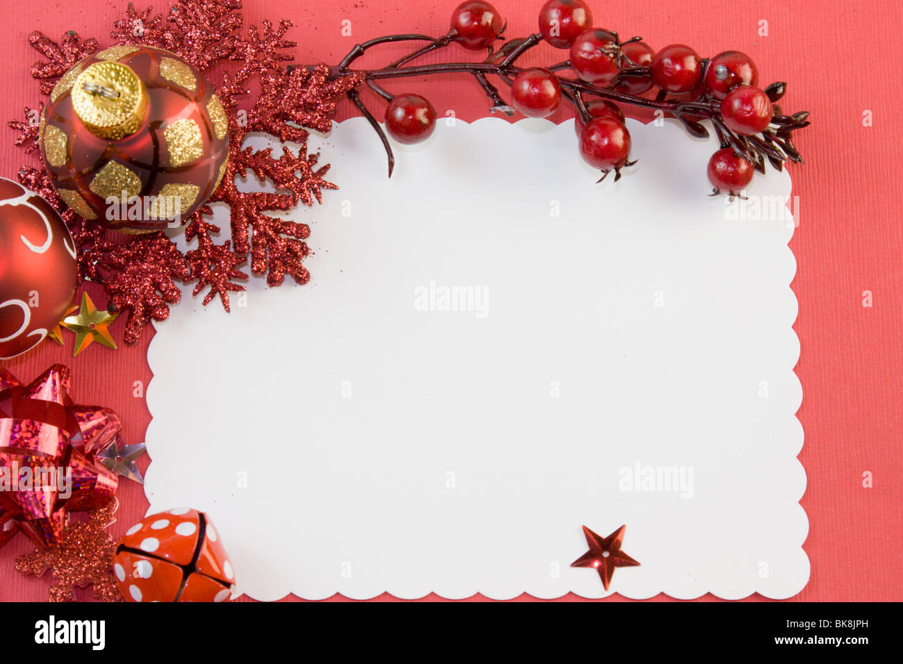 blank Christmas card with red baubles, snowflake, berries, star and copyspace Stock Photo