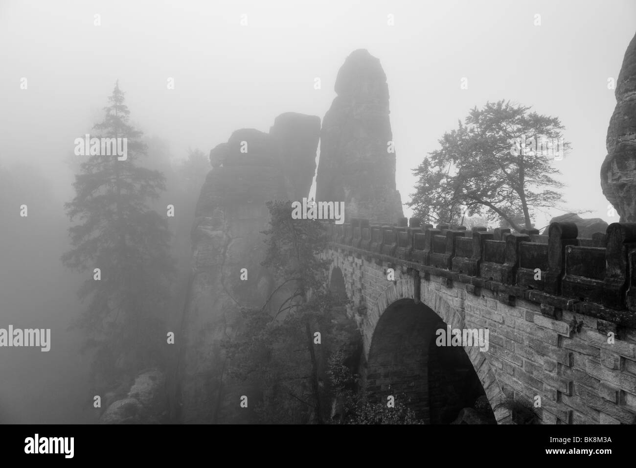 Rock massive of Bastei in National Park Sächsische Schweiz, Germany, on a misty morning in autumn Stock Photo