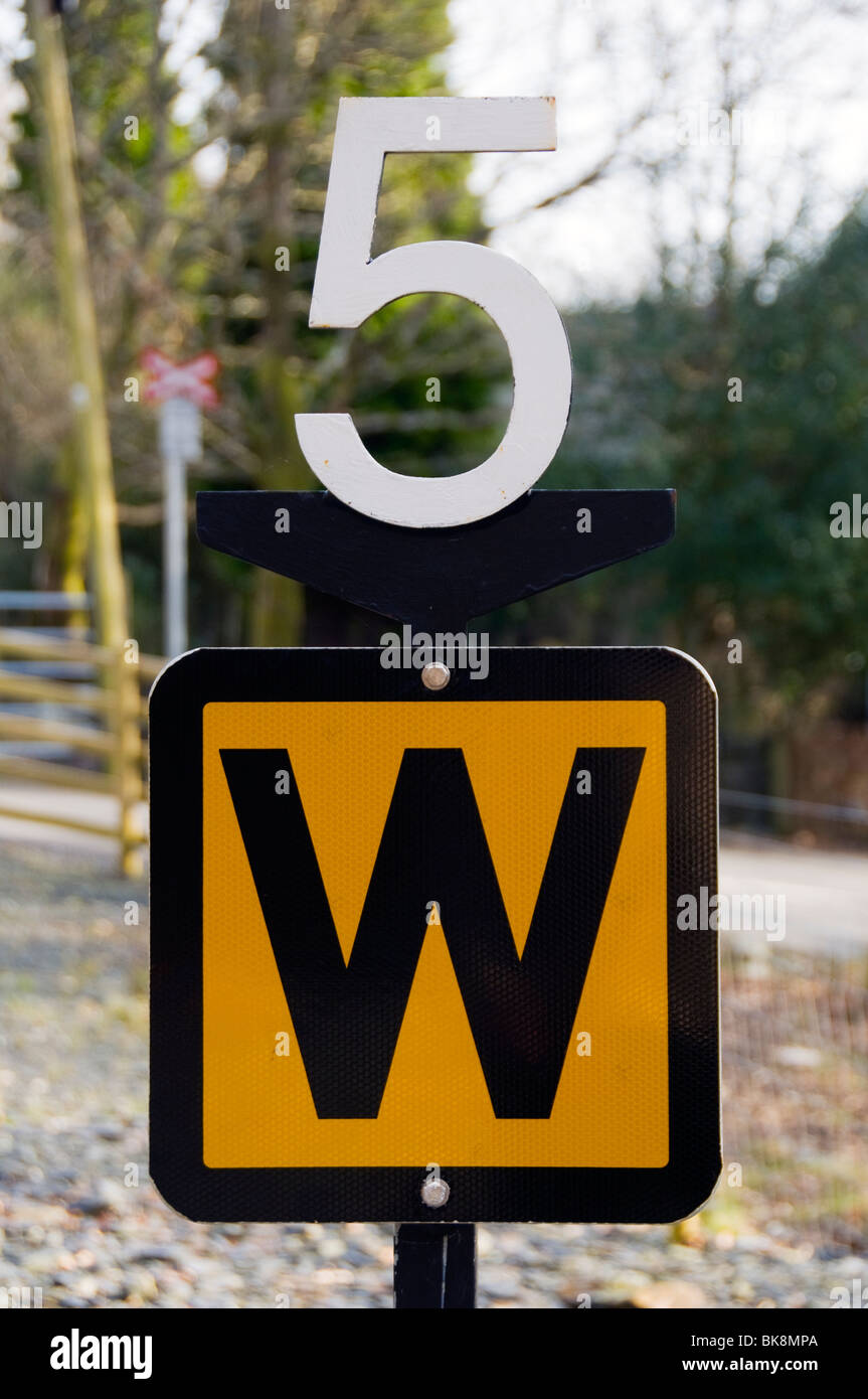 Speed restriction and whistle sign on the Welsh Highland Railway, Nantmor, Snowdonia, North Wales, UK Stock Photo