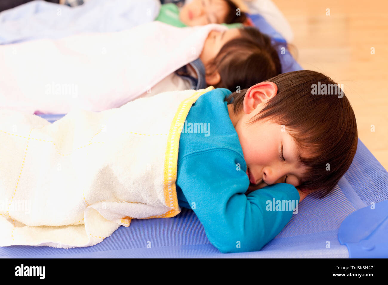 Children Sleeping at Day-care Center Stock Photo