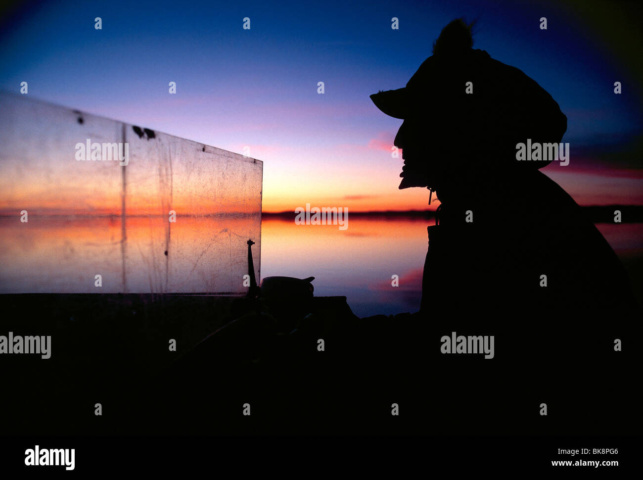 Inuit hunter traveling in a Inuit Freighter Canoe on Cumberland Sound