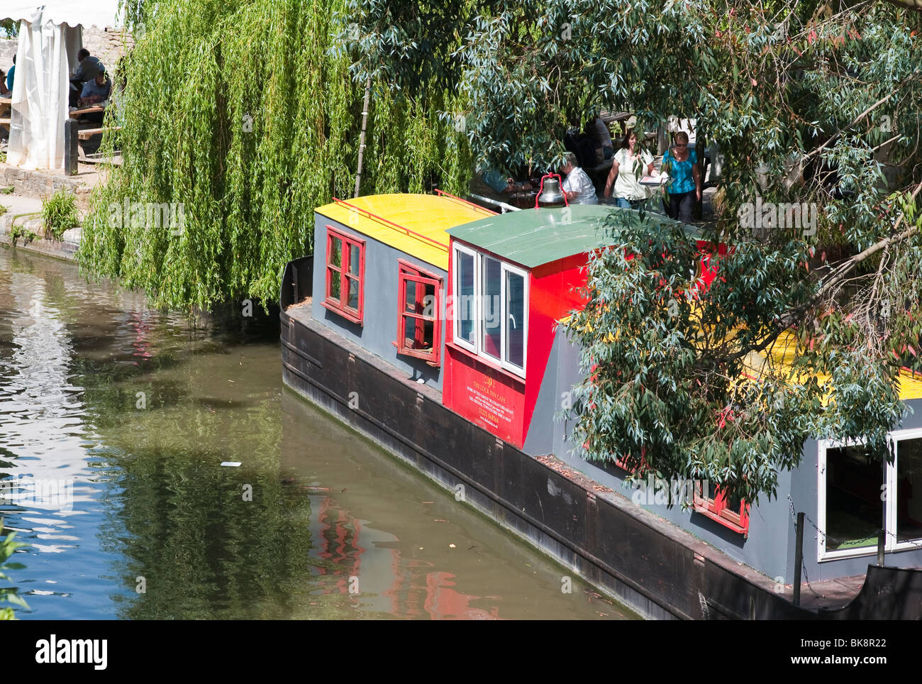 Canal boat converted to tea room moored alongside 'The Lock Inn' Cafe in 'Bradford on Avon' Wiltshire England UK EU Stock Photo