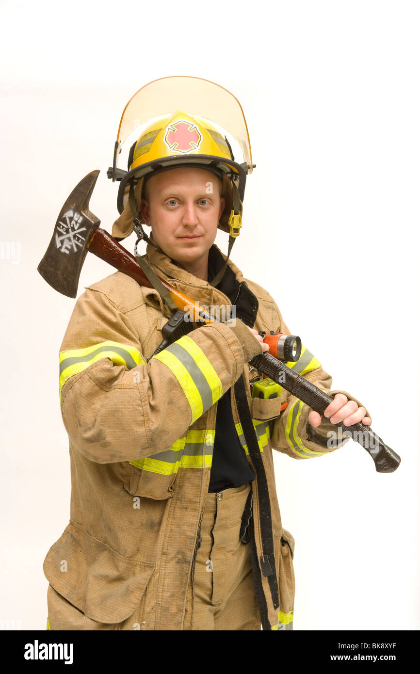 Fireman standing with an axe Stock Photo Alamy