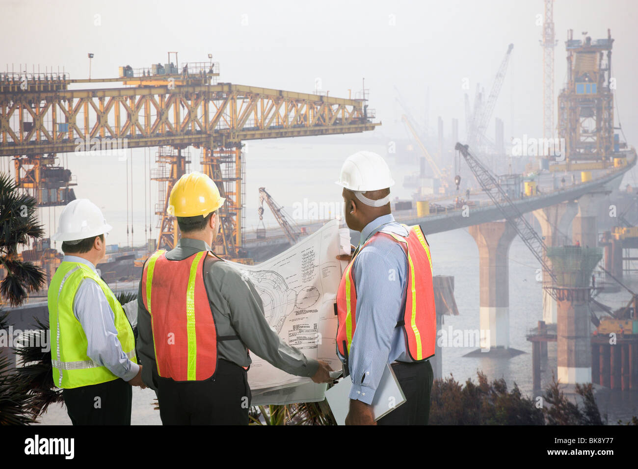 Foreman overlooking bridge construction, Mumbai, Maharashtra, India