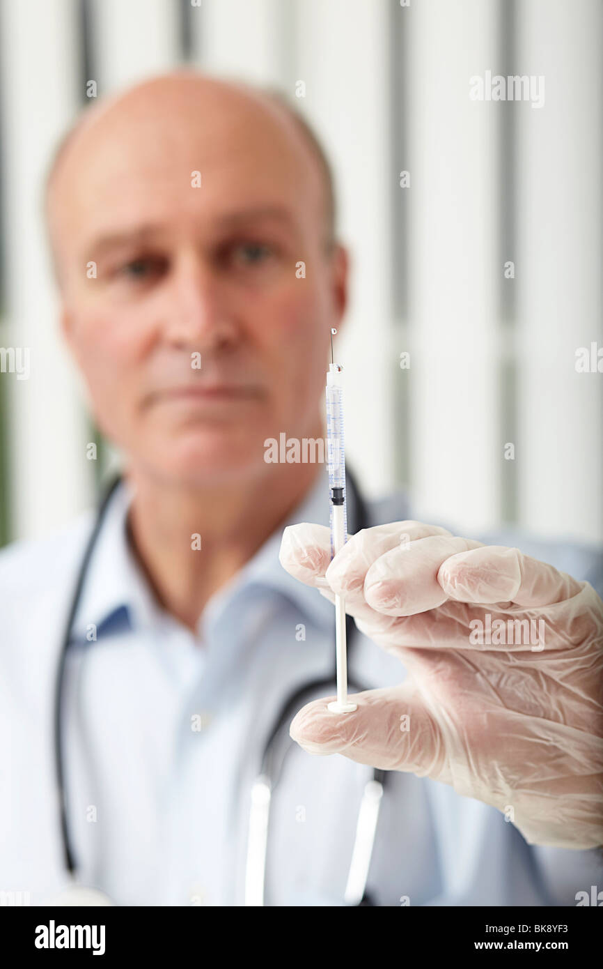 Doctor with a syringe Stock Photo Alamy