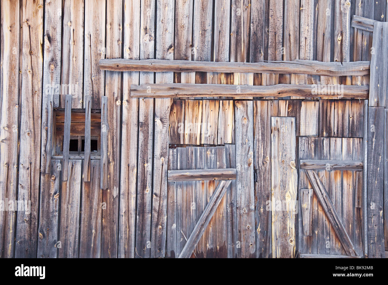 Wooden wall old country barn with a window and door Stock Photo - Alamy