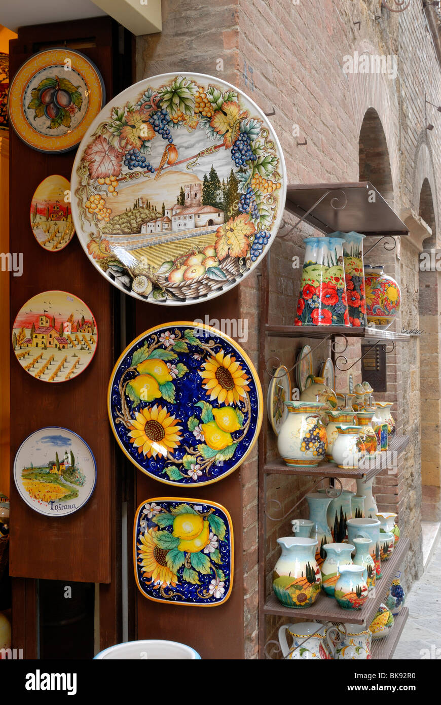 San Gimignano is very famous for its brightly coloured ceramic works. Ceramic shops in Via San Matteo sell plates, vases, pots.. Stock Photo
