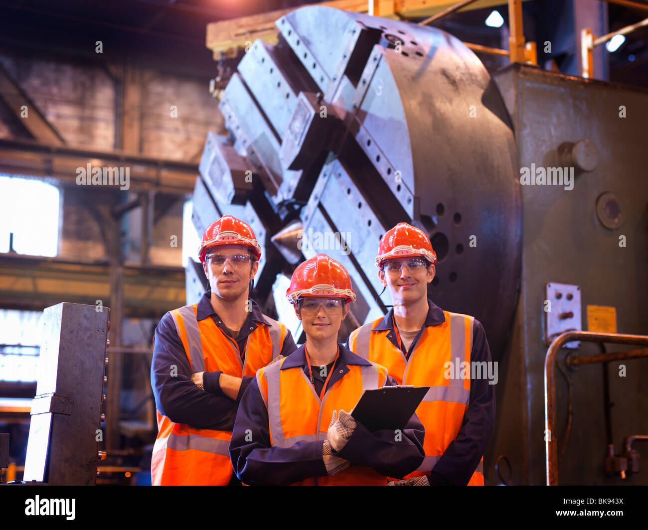 Steel Engineers In Front Of Lathe Stock Photo