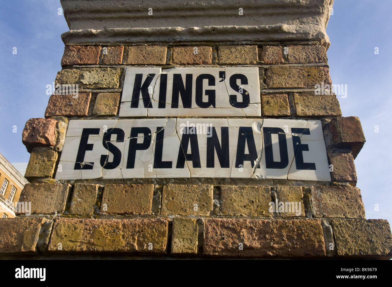 'Kings Esplanade' a Ceramic road street sign mounted in a brick pillar on Hove promenade. Stock Photo