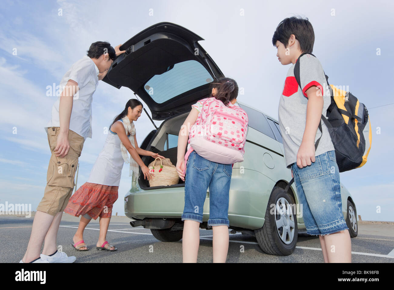 Family Opening Trunk of a Car Stock Photo Alamy