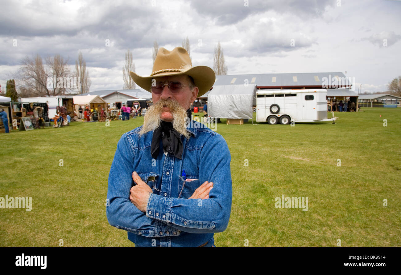 A cowboy with a large droopy mustache at a small county fair in central Oregon Stock Photo