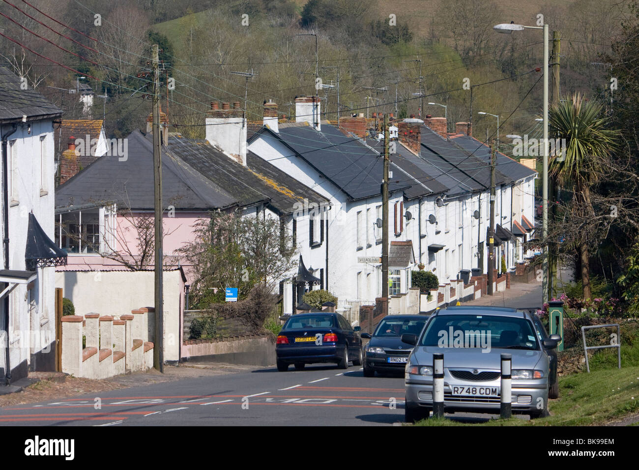 Row of attractive cottages along main road at Newton Poppleford, Devon Stock Photo