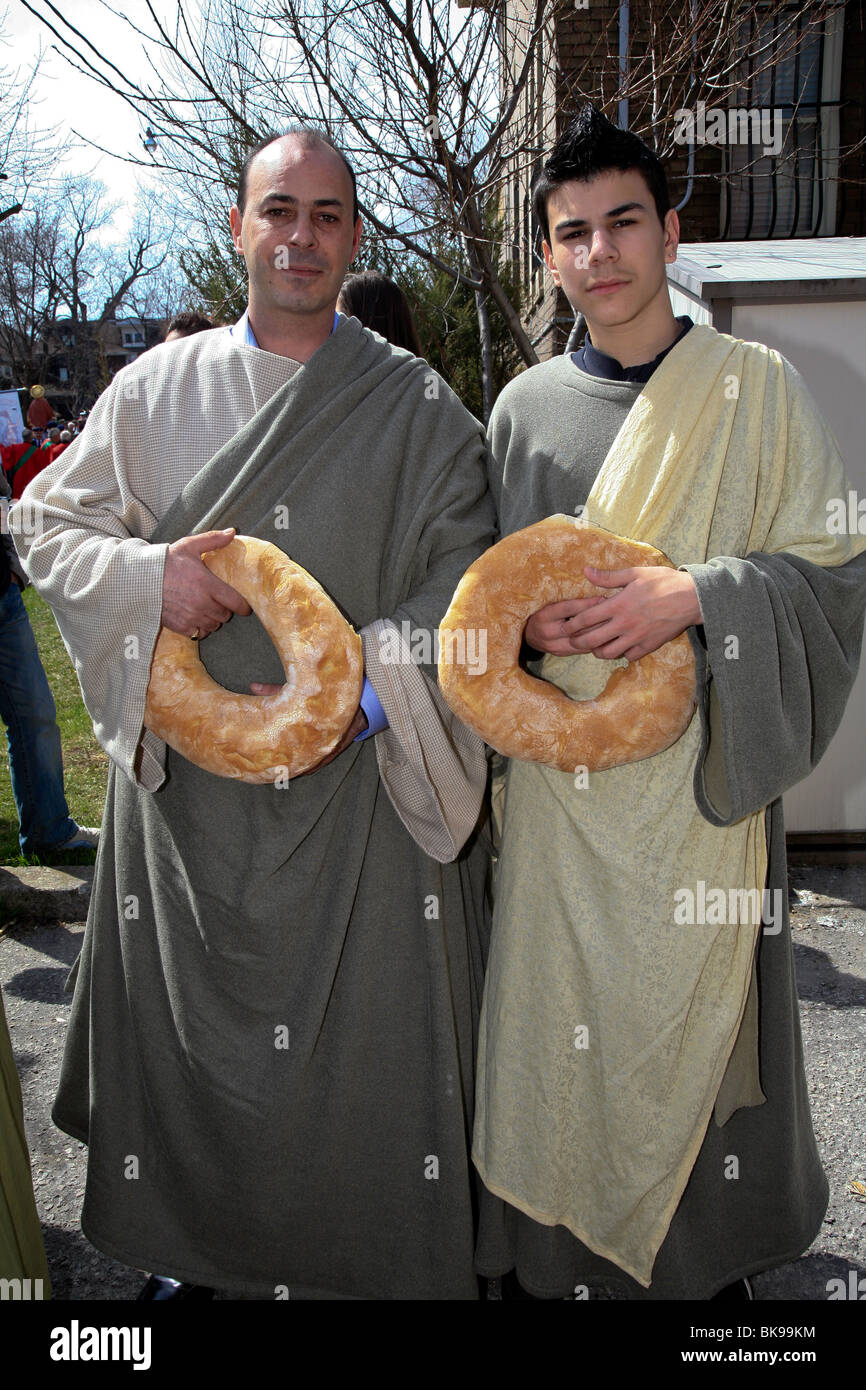 2 men with bread at Holy Easter or Good Friday Procession Parade,' Little Italy', Toronto,Ontario,Canada,North America Stock Photo
