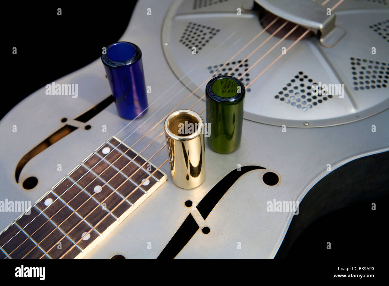 Old steel bodied resonator guitar and slides Stock Photo Alamy