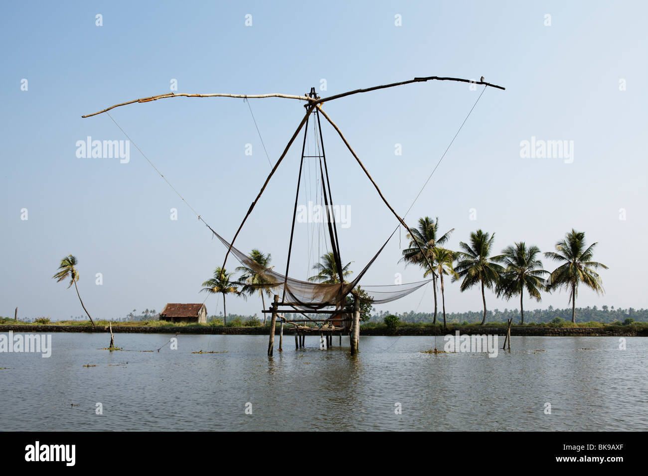 Chinese nets, huge hanging fishing nets, are one of the biggest sights in the backwaters of Ernakulam area, Kerala, India. Stock Photo