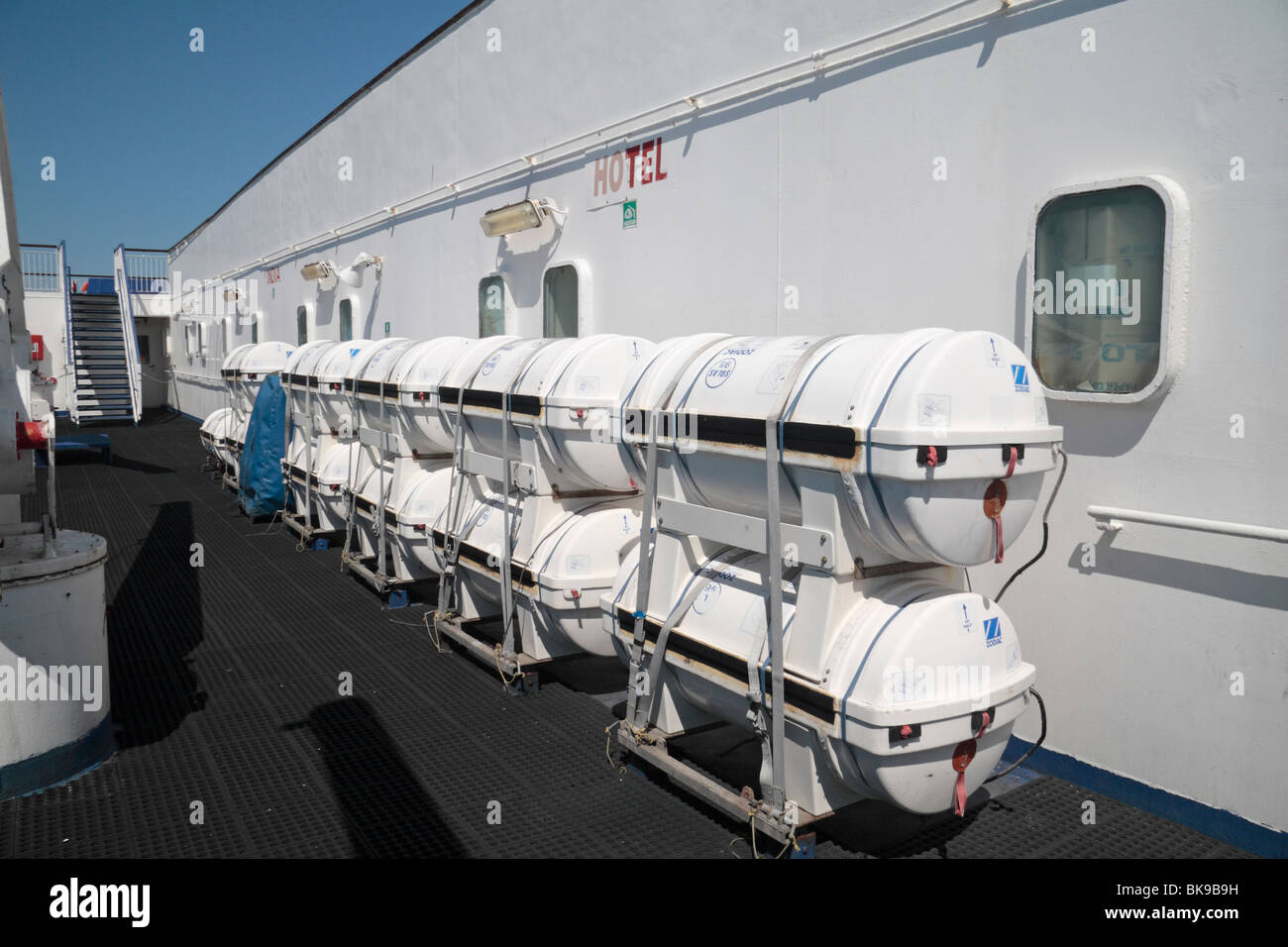 A line of inflatable life rafts on the deck of the Stena Europe car ferry, on the Irish Sea. Stock Photo