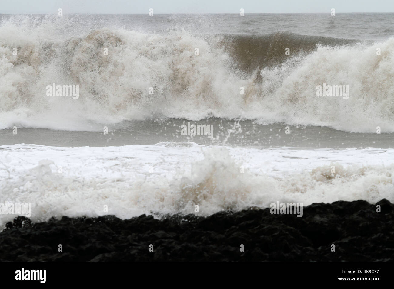 Atlantic breakers on the beach at Porthcawl running alongside the Esplanade Stock Photo