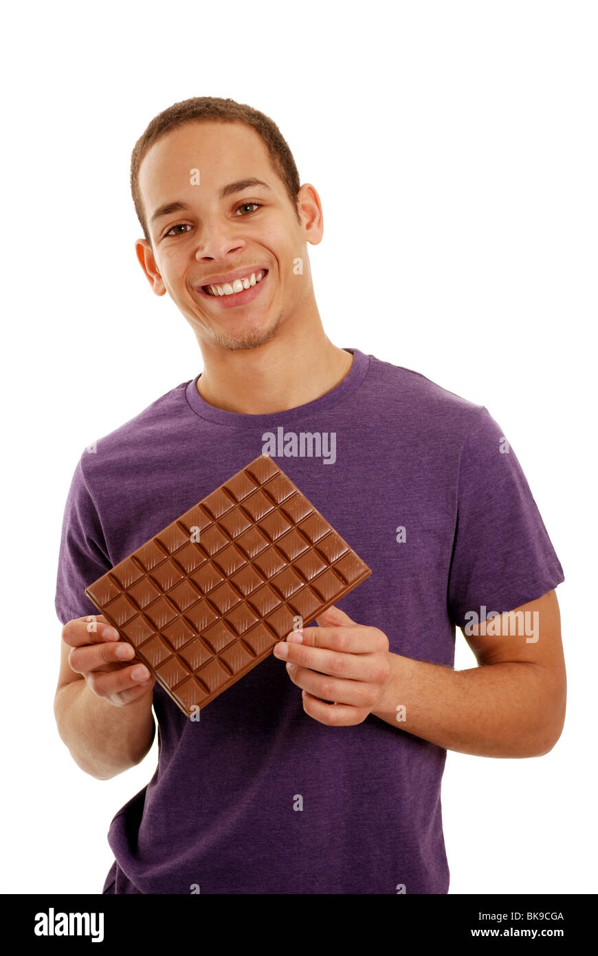 Boy holding a bar of chocolate Stock Photo