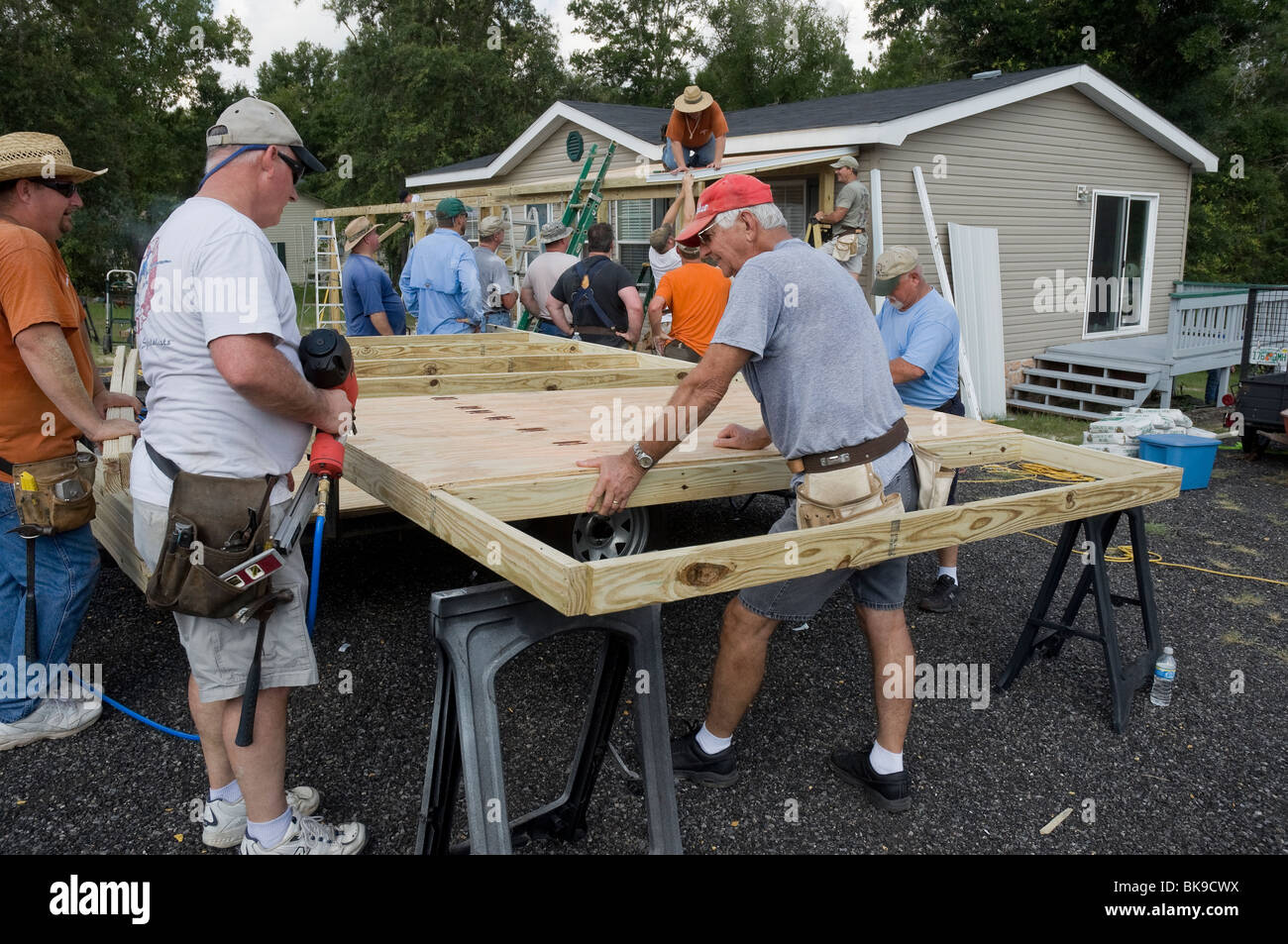 100 Club from First Baptist Church of High Springs works on mission outreach project in Ft. White. Stock Photo