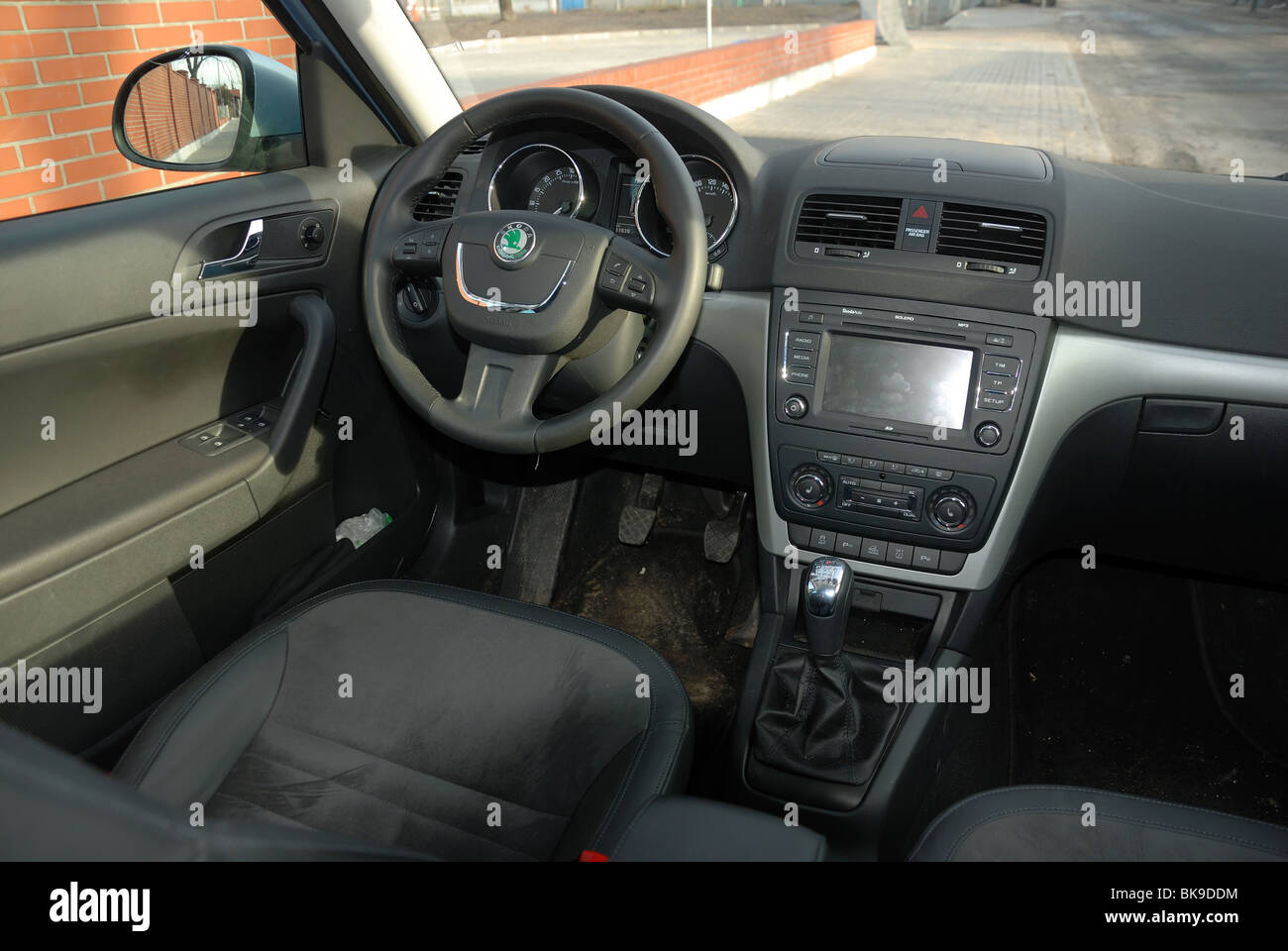 Skoda Yeti 2.0 TDI 4x4 - 2009 - light blue metallic - five doors (5D) - Czech compact SUV - interior (cabin console dashboard) Stock Photo