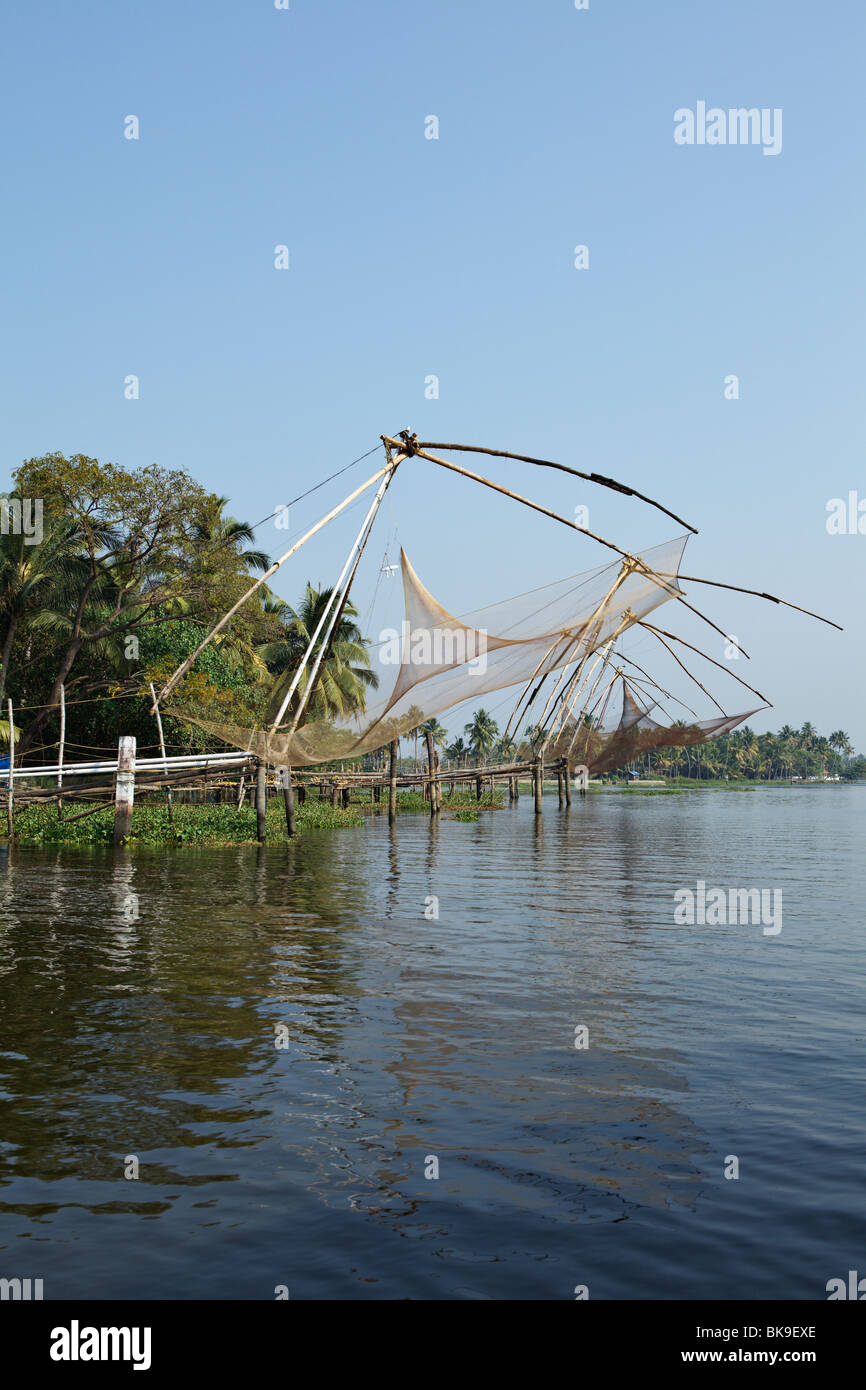 Chinese nets, huge hanging fishing nets, are one of the biggest sights in the backwaters of Ernakulam area, Kerala, India. Stock Photo