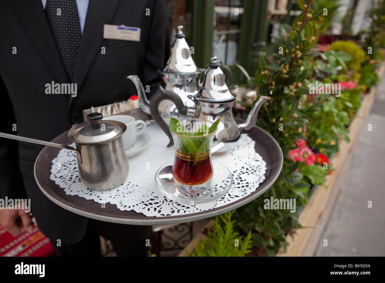 A waiter serves mint tea at Assaha restaurant in London. (W2) Stock Photo